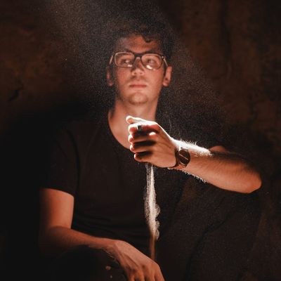 Close-up of a person's hands in a meditative pose.
